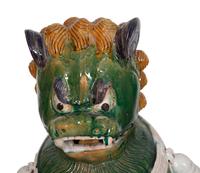 A Pair of Chinese Sançai Glazed Ceramic Guardian Lions on Pedestal Bases