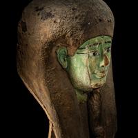 An Egyptian Painted Wood Sarcophagus Head