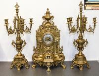 A Continental Gilt Metal Clock Garniture, Imperial Height of clock 24 inches. — 20TH CENTURY