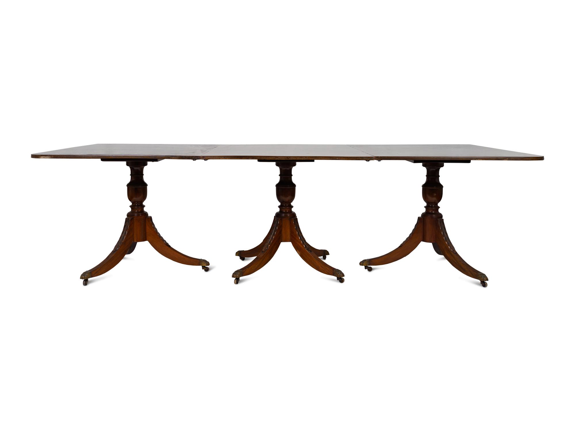 A Regency Style Mahogany Three Pedestal Dining Table — EARLY 20TH CENTURY