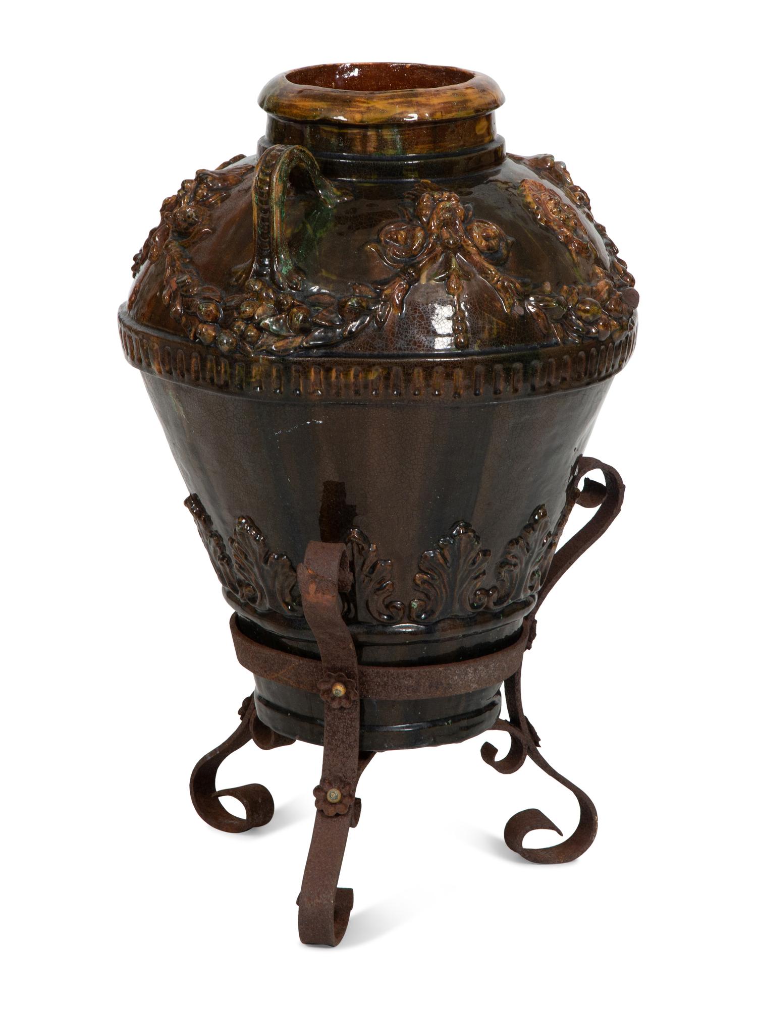 Italian Brown Glazed Ceramic Amphora in an Iron Stand