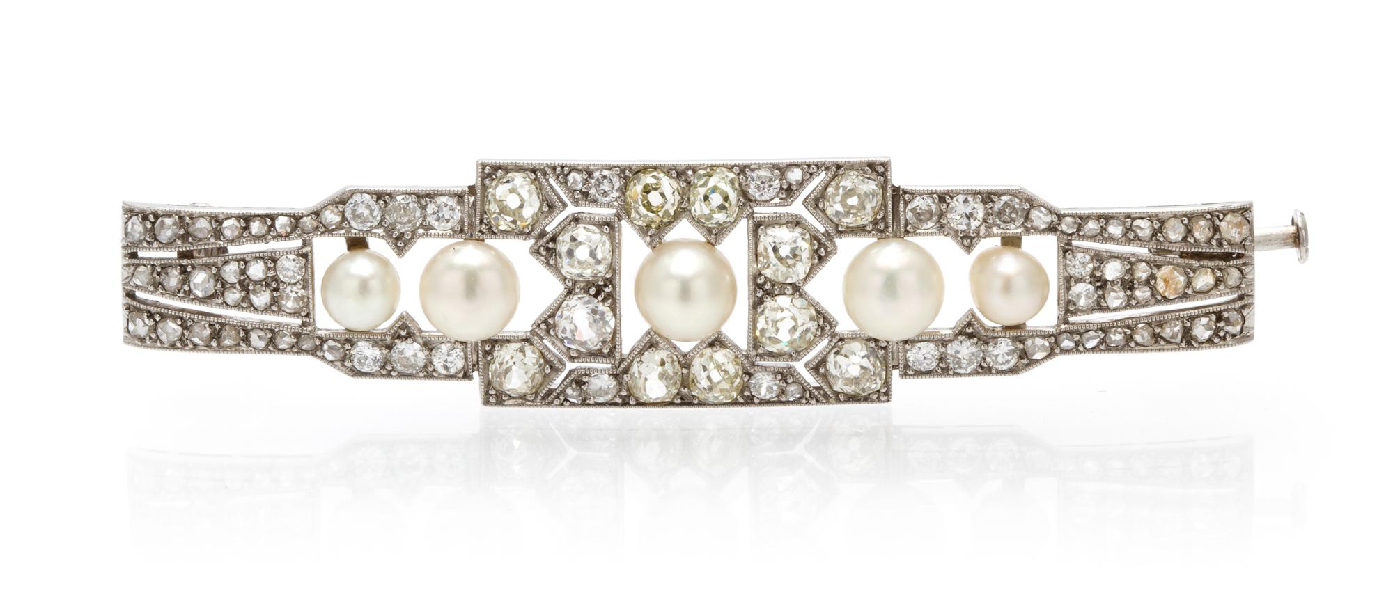 An Art Deco Platinum, Diamond and Natural Pearl Bar Brooch, 8.80 dwts.