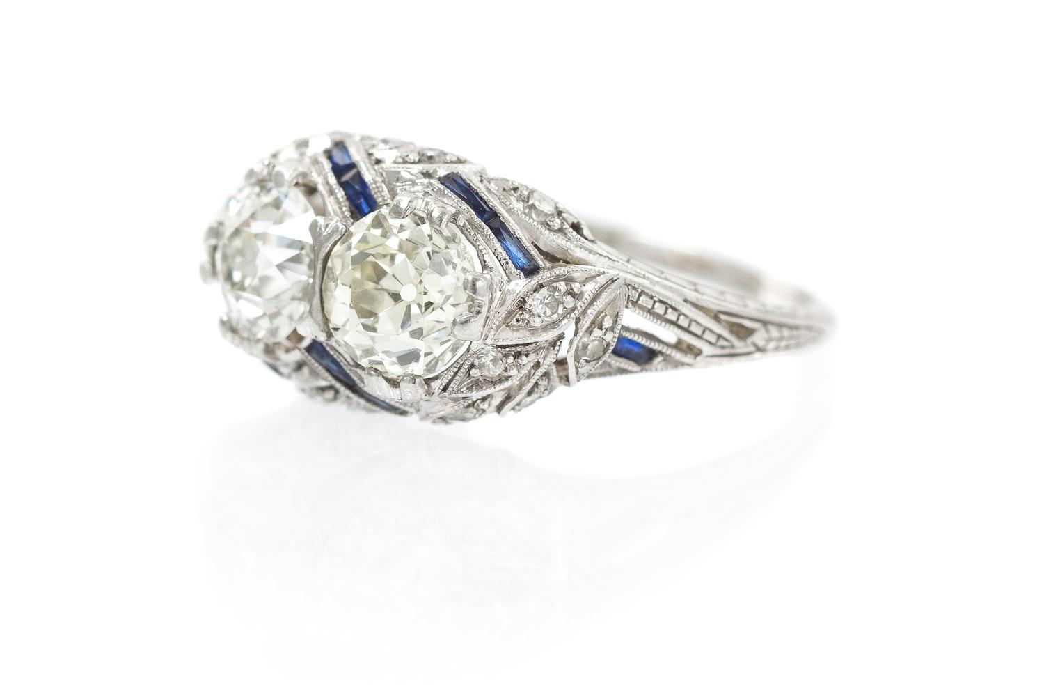 An Art Deco Platinum, Diamond and Synthetic Sapphire Ring, 2.70 dwts.