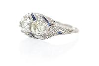 An Art Deco Platinum, Diamond and Synthetic Sapphire Ring, 2.70 dwts.