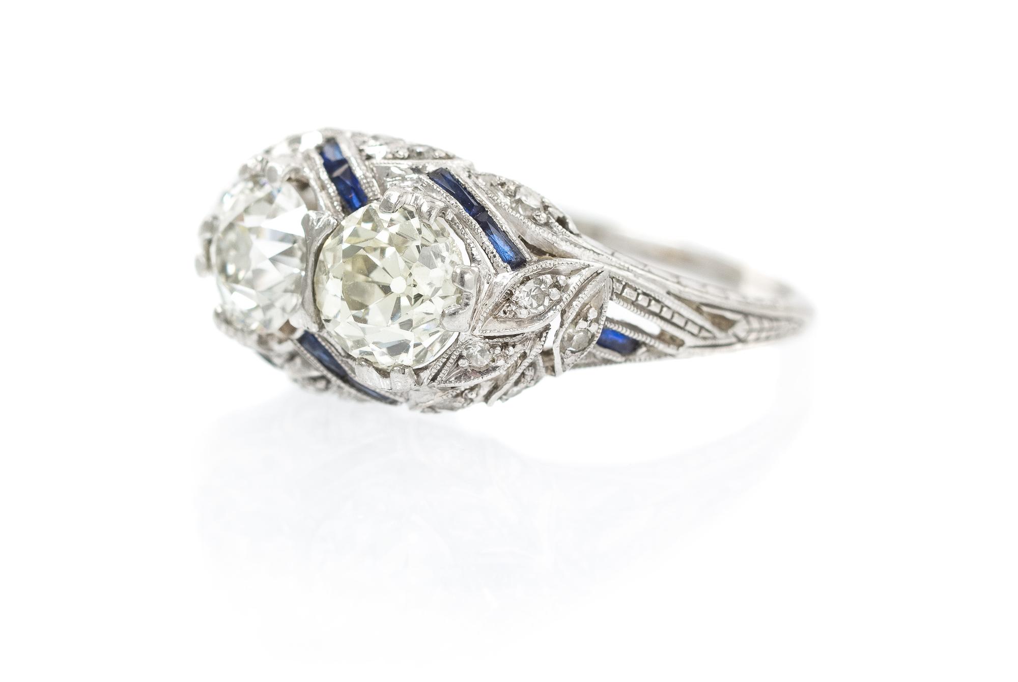 An Art Deco Platinum, Diamond and Synthetic Sapphire Ring, 2.70 dwts.