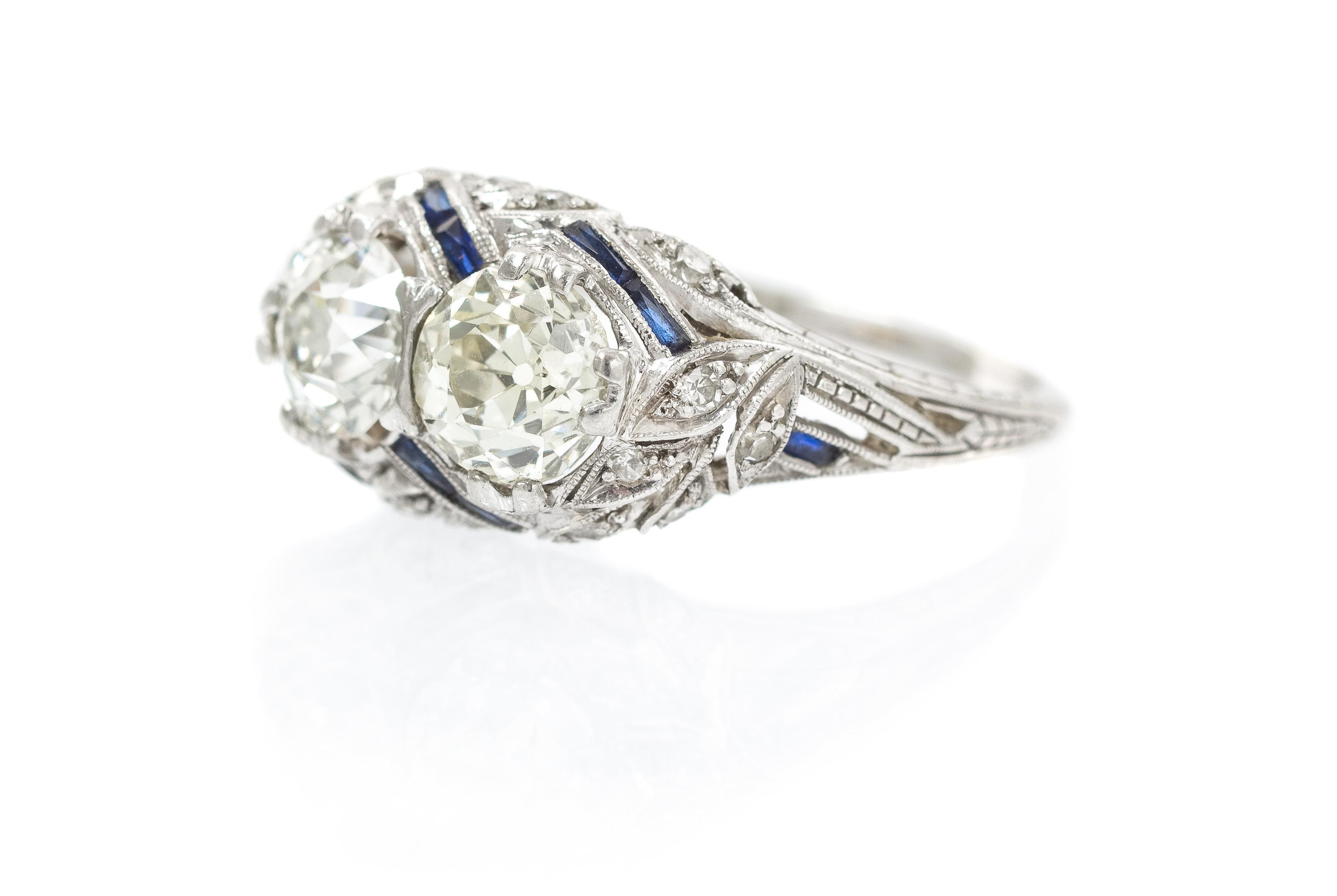 An Art Deco Platinum, Diamond and Synthetic Sapphire Ring, 2.70 dwts.
