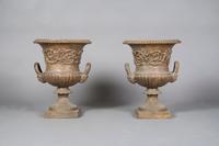 A Pair of Victorian Style Cast Iron Urns, Height 22 1/2 inches.