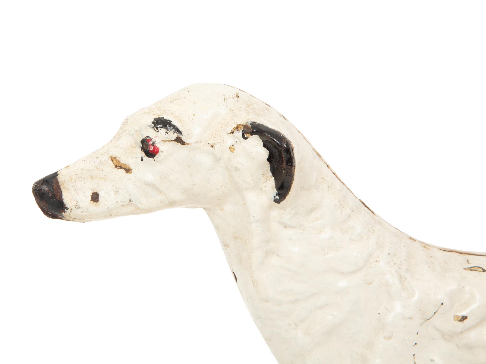 A Victorian Painted Iron Greyhound Doorstop and a Painted Wood Basket Doorstop
