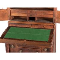 A Classical Figured Maple and Mahogany Desk-and-Bookcase