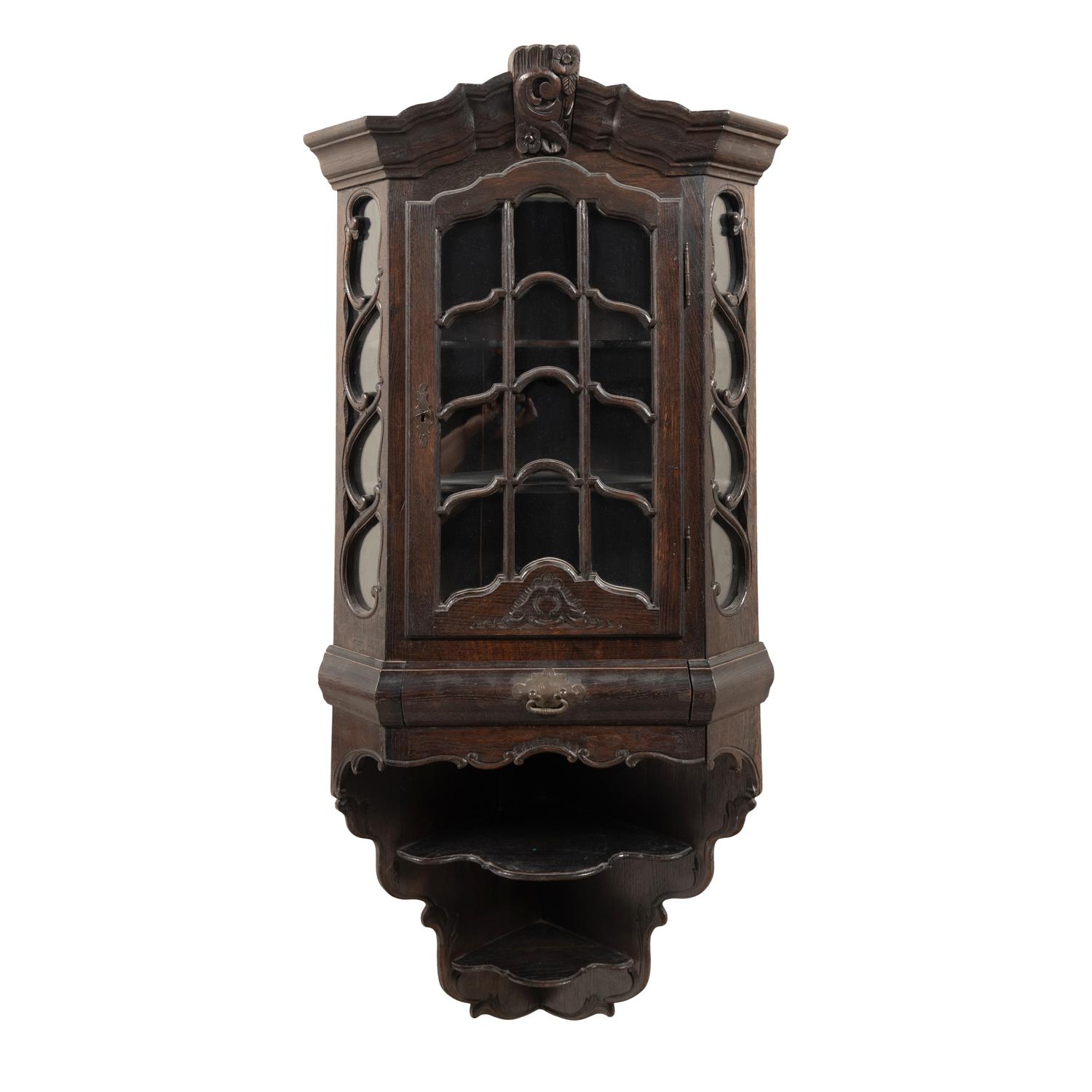 A Dutch Carved Oak Corner Cabinet