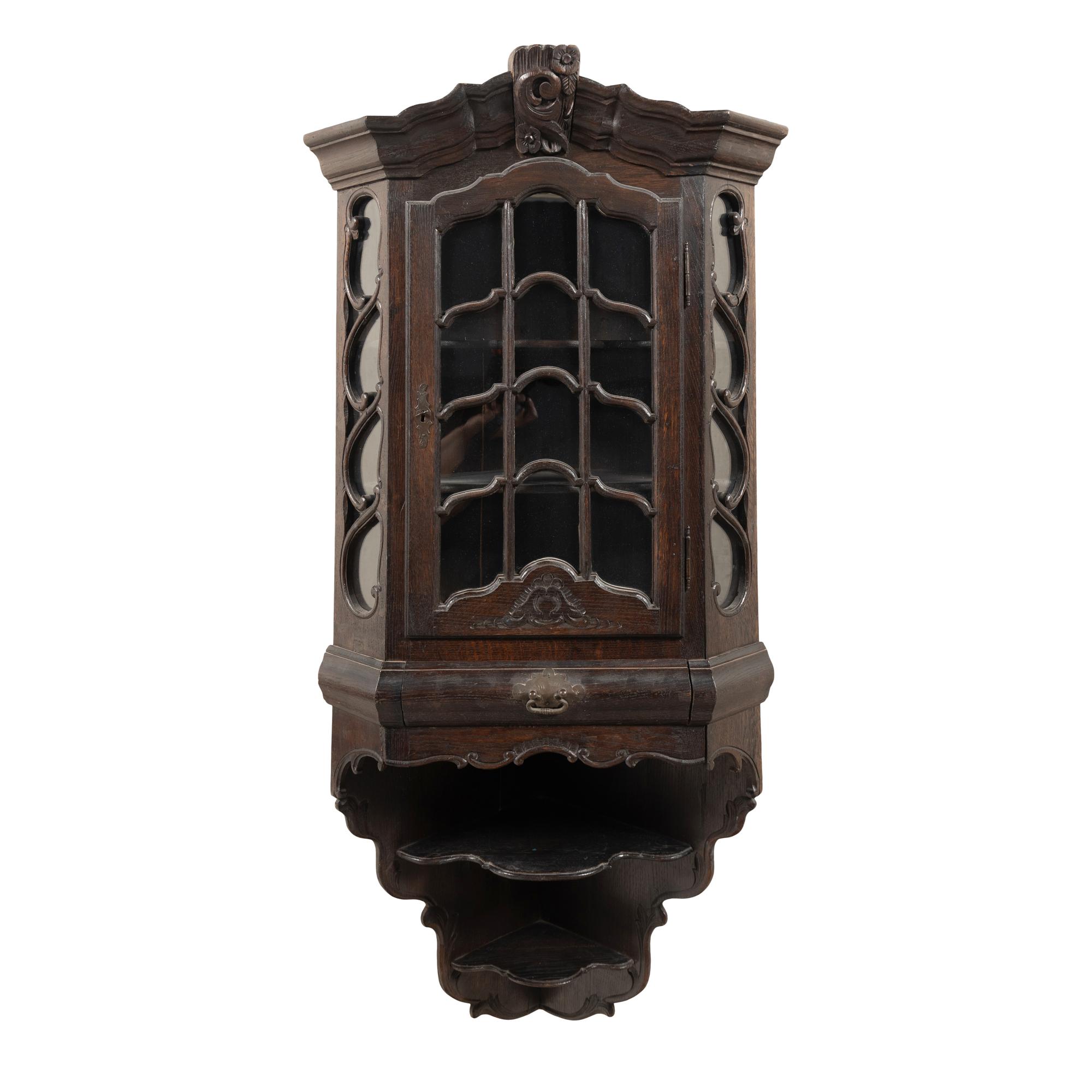 A Dutch Carved Oak Corner Cabinet