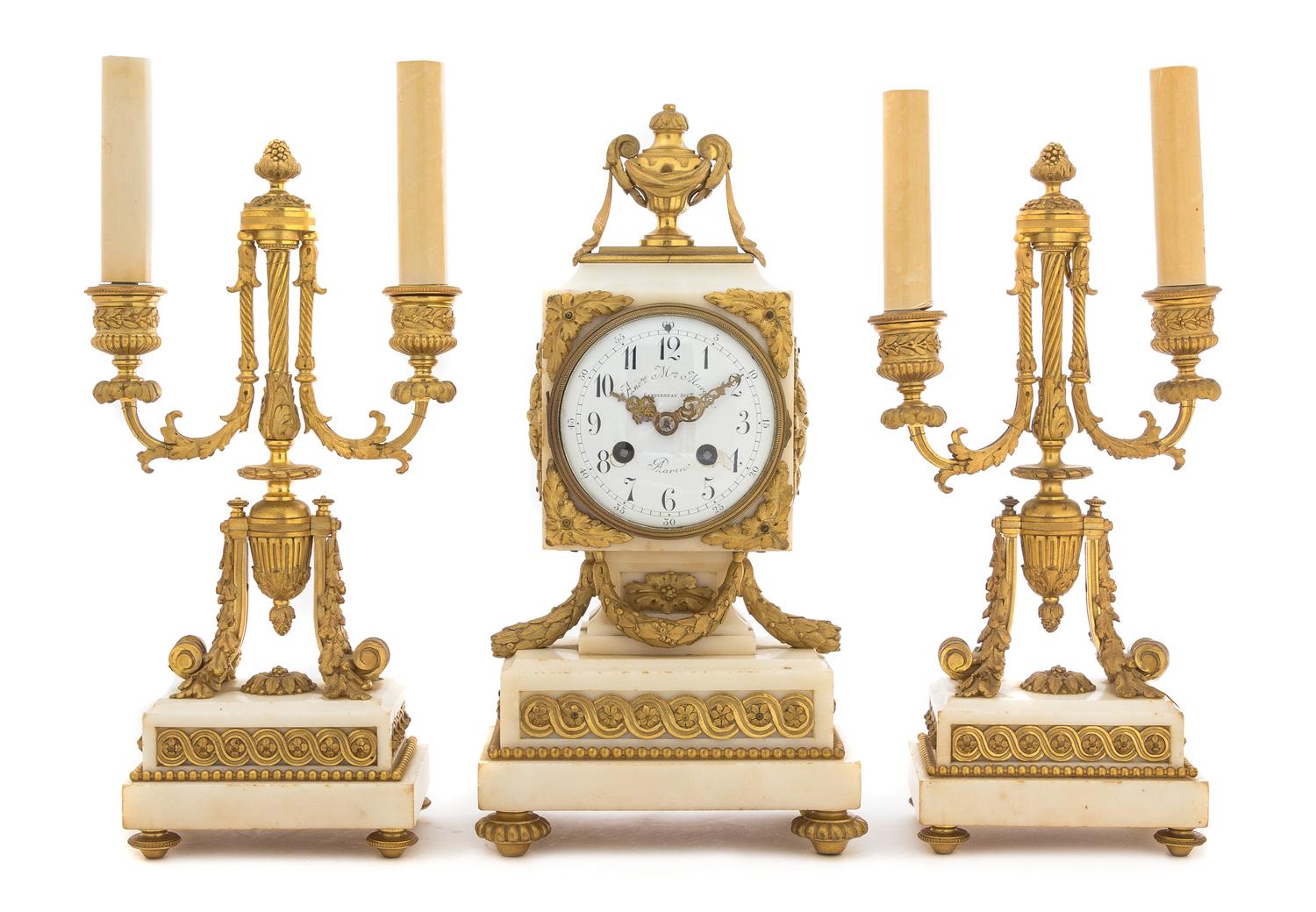 A French Gilt Bronze and Marble Three-Piece Clock Garniture Height of candelabra 16 3/4 inches. — MAISON MARQUIS, LANGUEREAU, PARIS, 19TH CENTURY