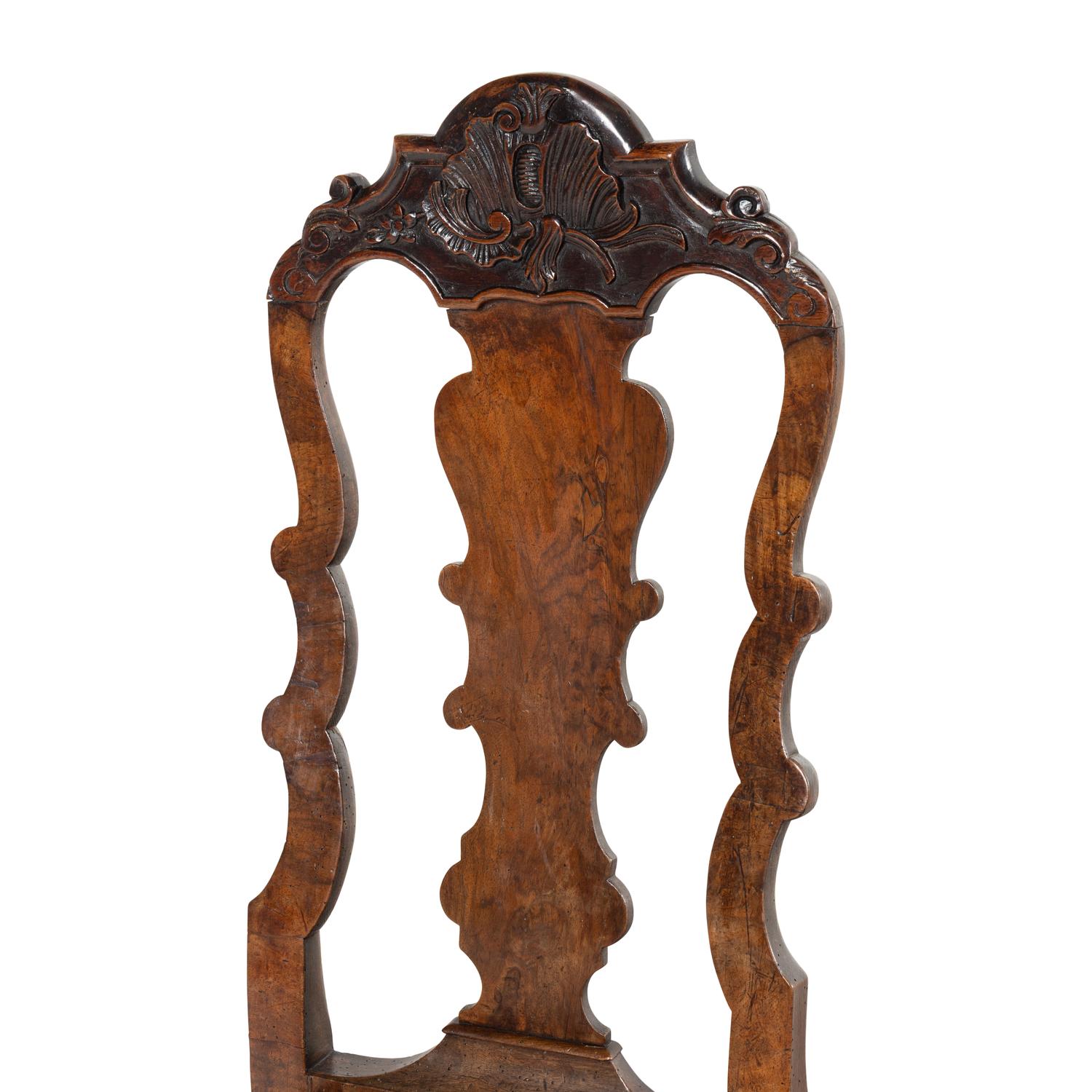 A Set of Three Dutch Carved Walnut Side Chairs