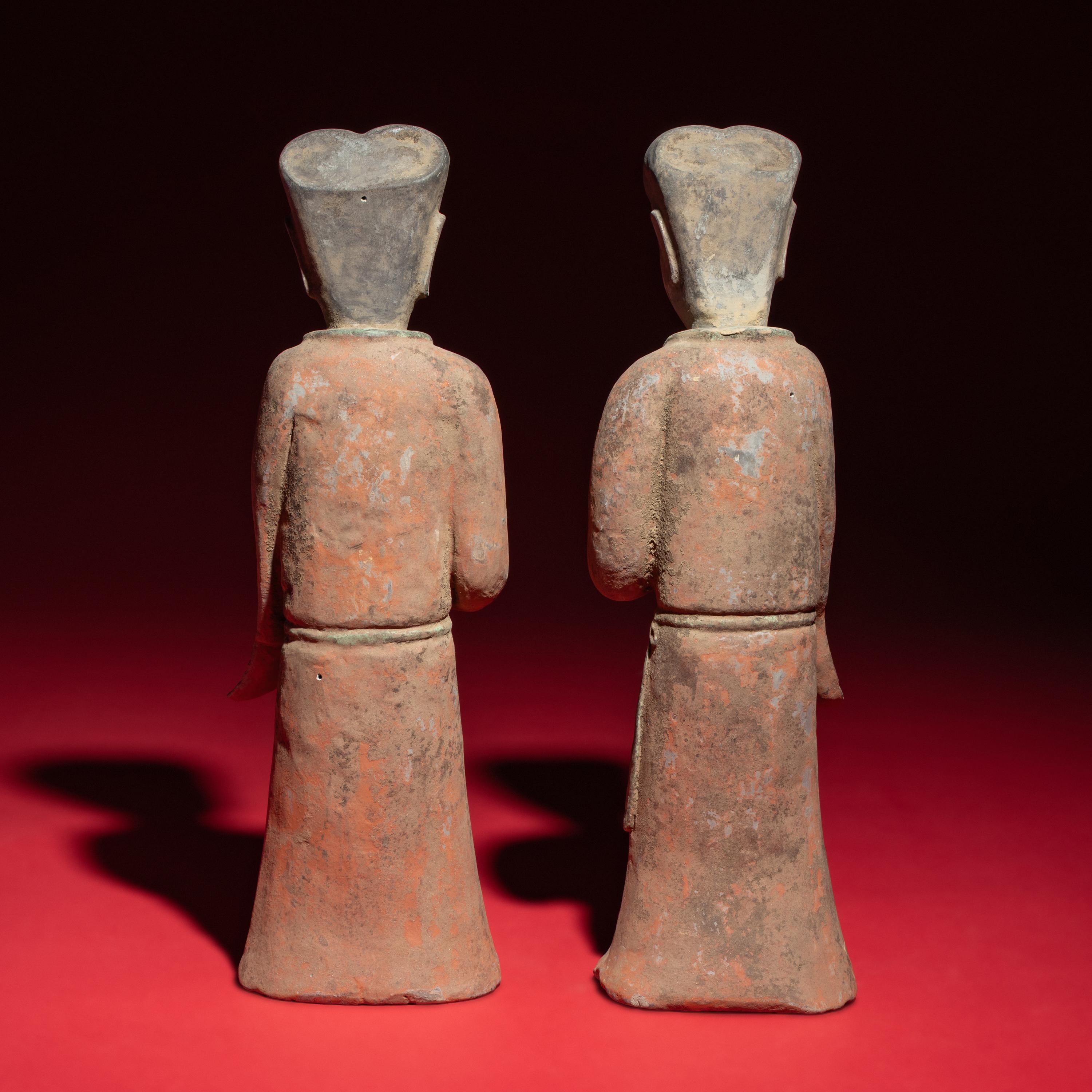 A Pair of Chinese Painted Grey Pottery Ladies with Owls, Han Dynasty — 漢 灰陶彩繪持鷹女俑一對