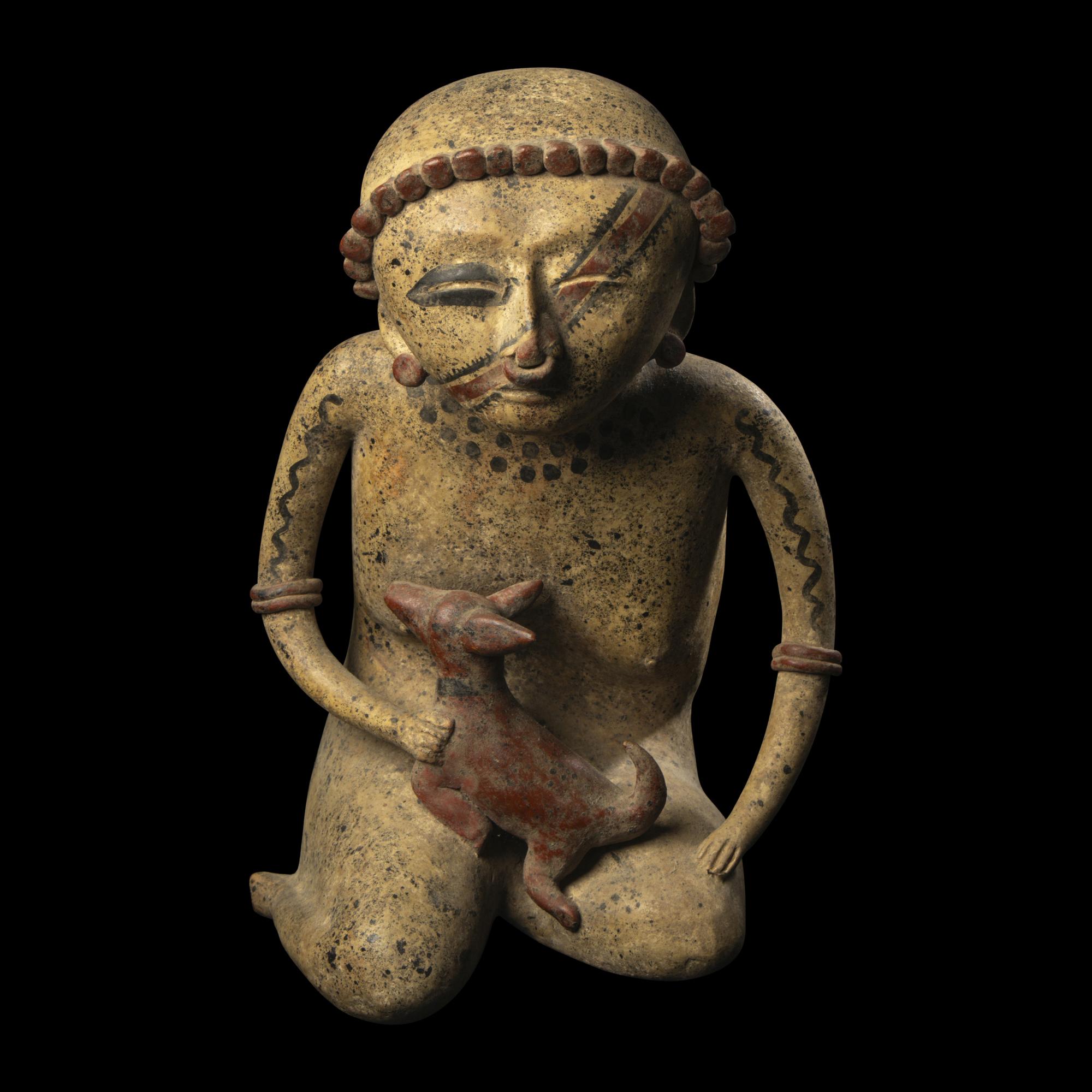 A Nayarit Terracotta Seated Figure with Dog