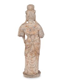 A Chinese Carved Stone Standing Guanyin Figure with Remnants of Polychrome Decoration