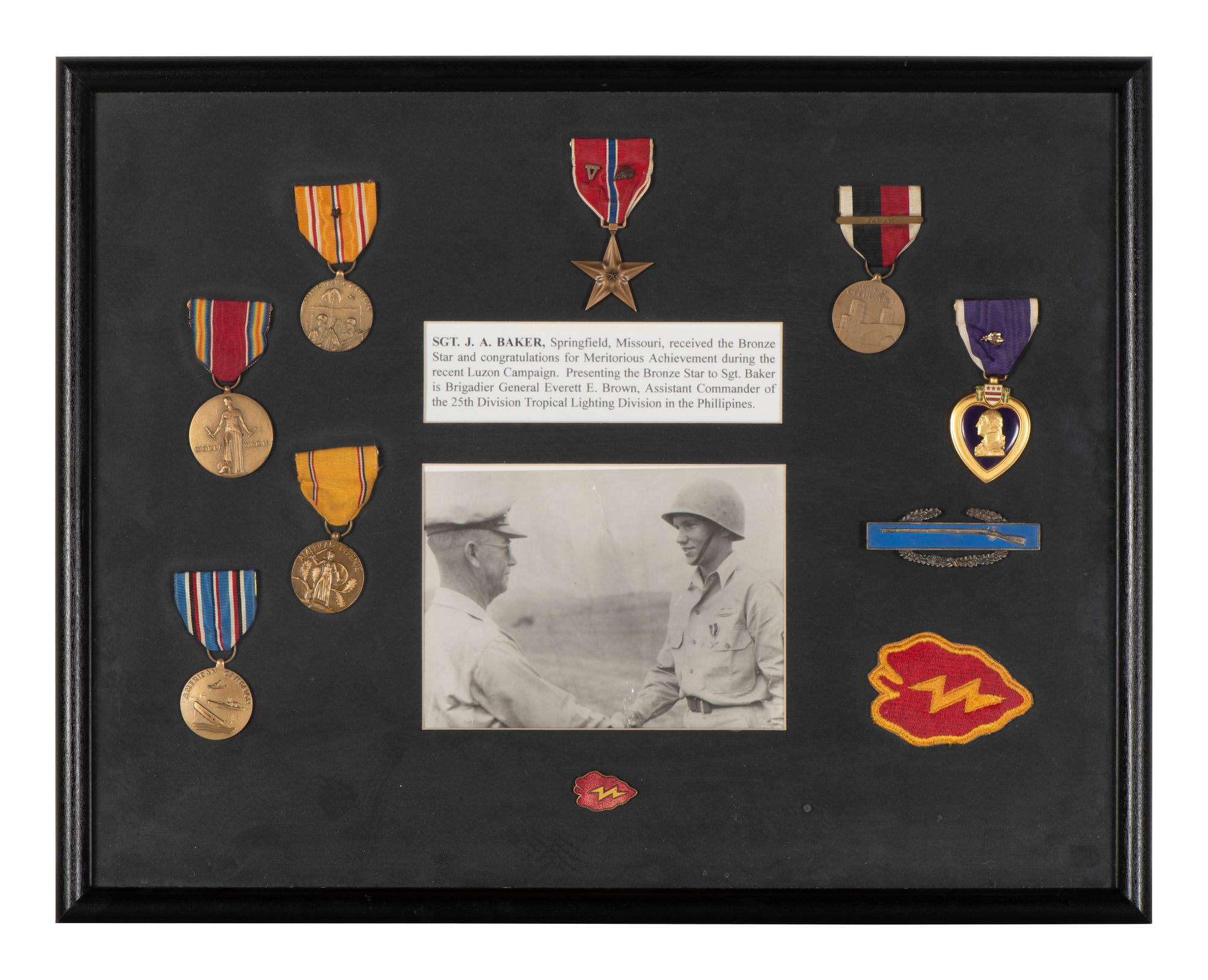 [WORLD WAR II]. Two framed displays featuring medals and patches of identified soldiers.