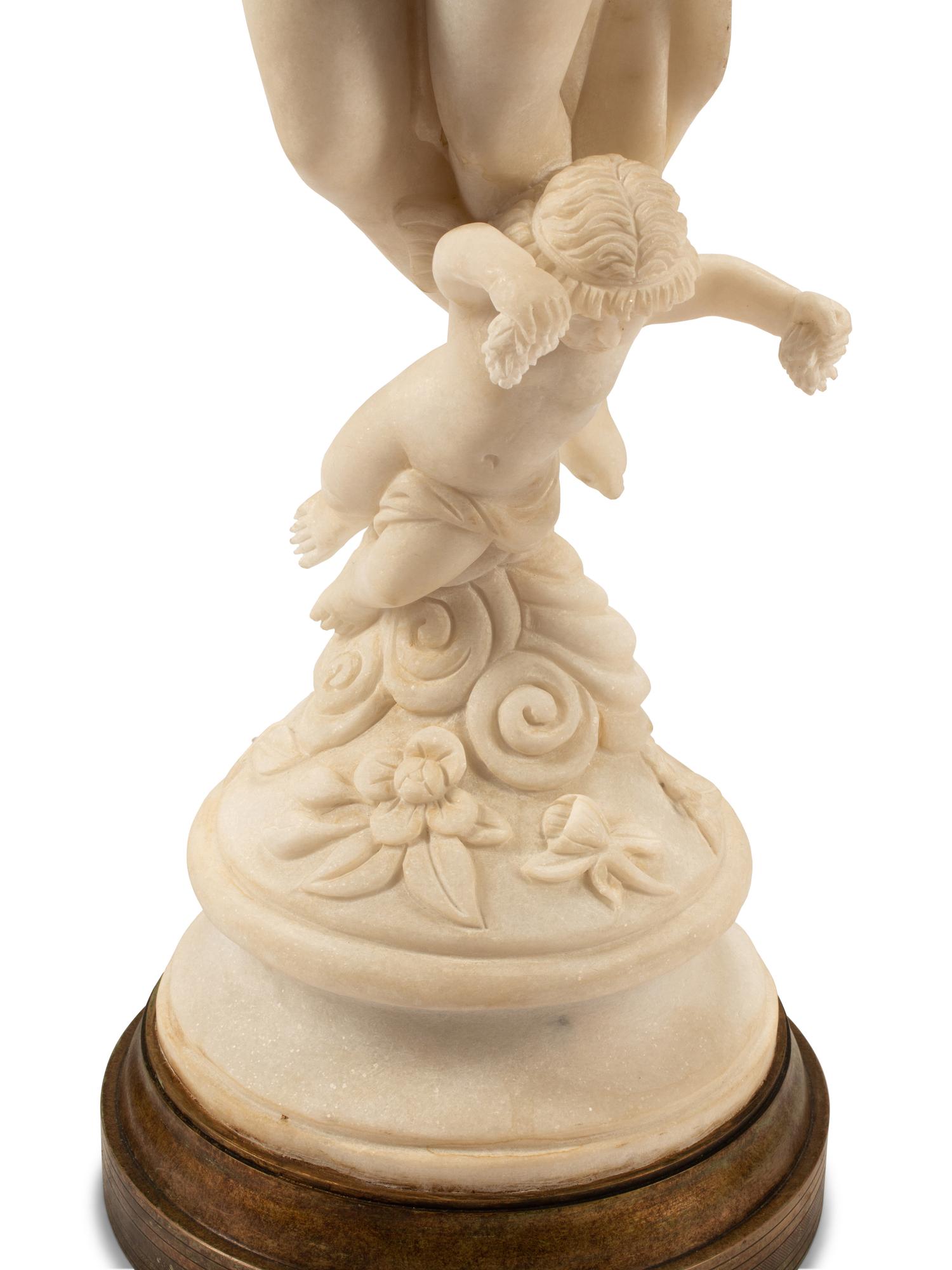 A Pair of Italian Marble Figures of Ladies with Cherubs