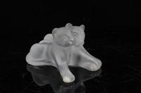 A Lalique Molded and Frosted Glass Figural Group Height 3 inches.