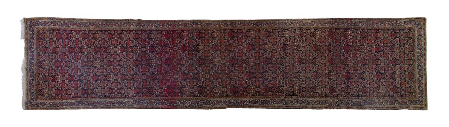 A Northwest Persian Wool Runner, 15 feet 2 inches x 3 feet 6 inches.
