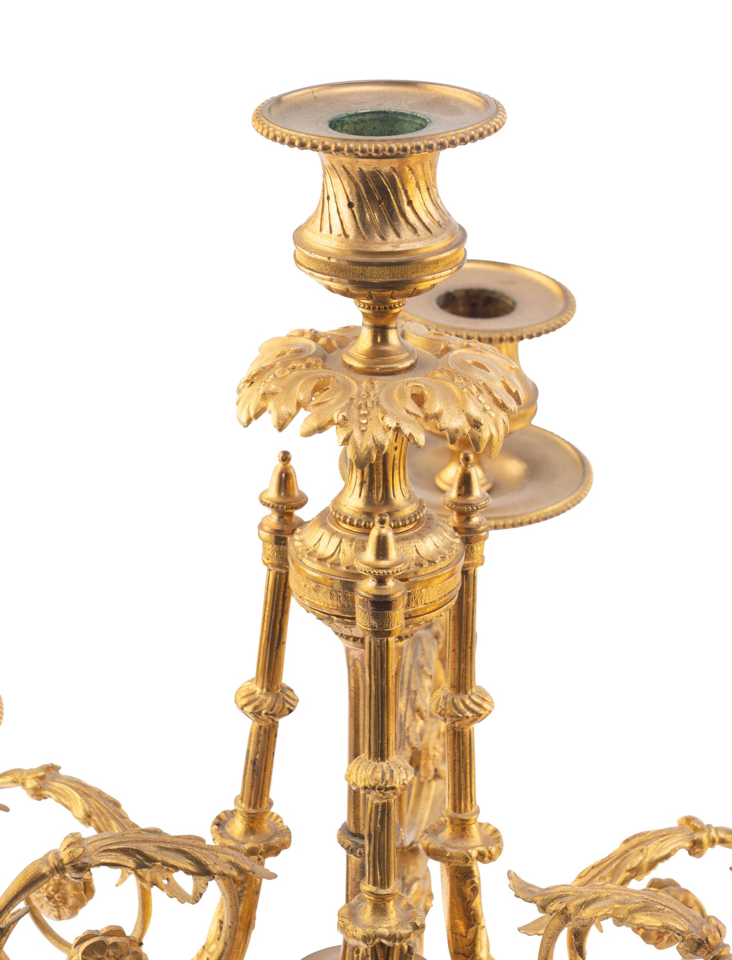 A Pair of Louis XV Style Gilt Bronze and Persian Grey Marble Six-Light Candelabra