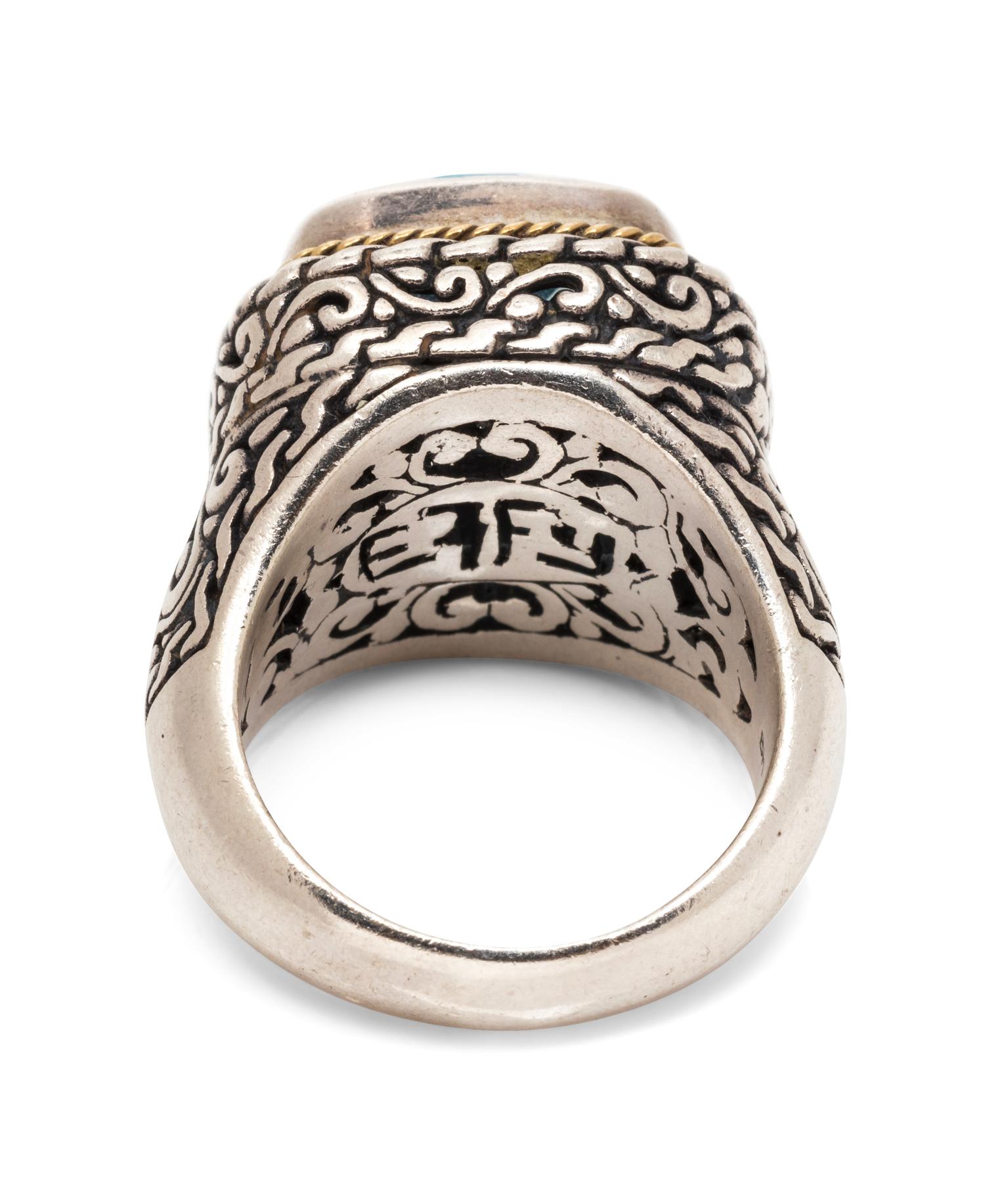 A Sterling Silver, 18 Karat Yellow Gold, and Blue Topaz Ring, Effy,