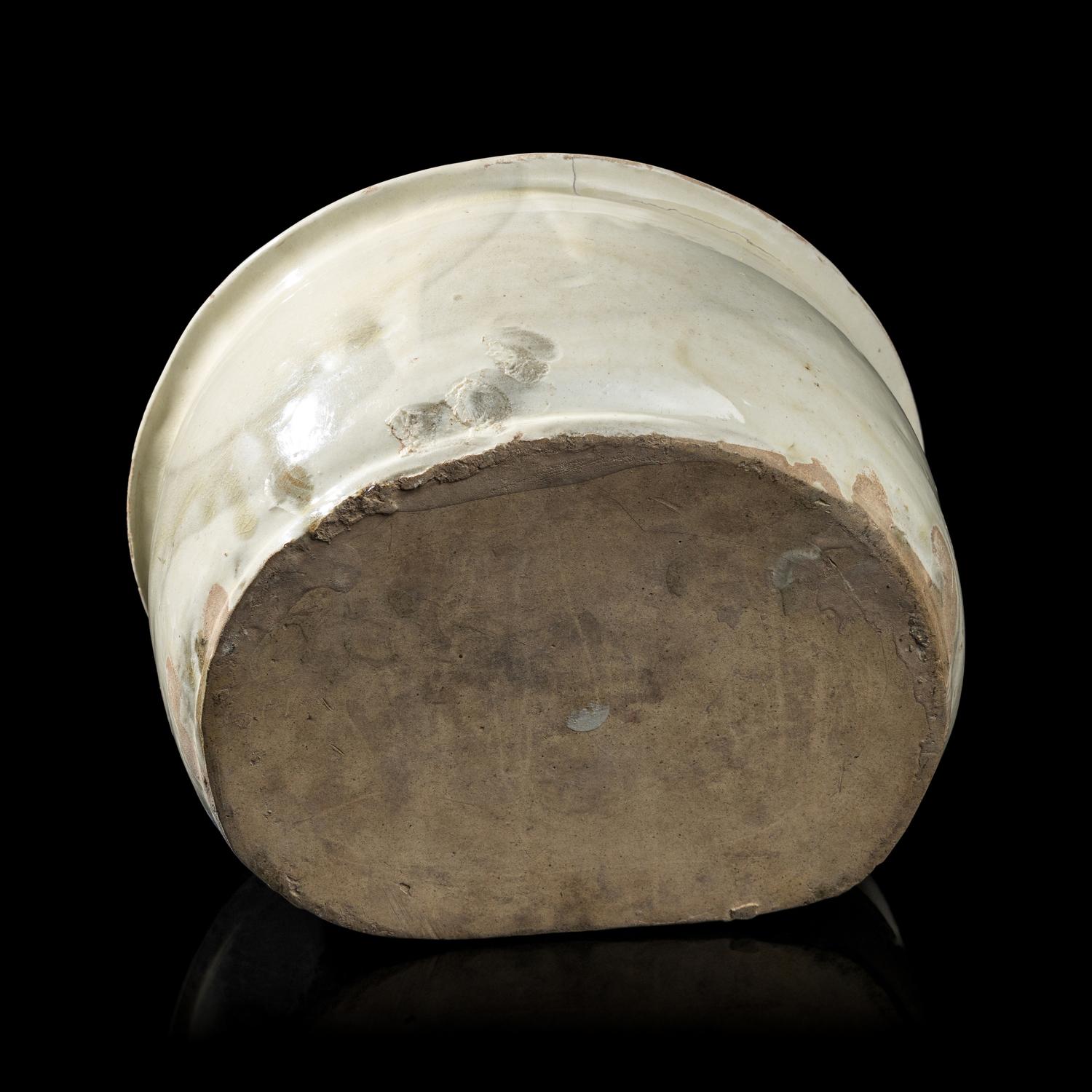 A Chinese Cizhou- Type White Glazed 'Floral' Porcelain Pillow, Yuan Dynasty 元 磁州窯白釉花卉紋枕