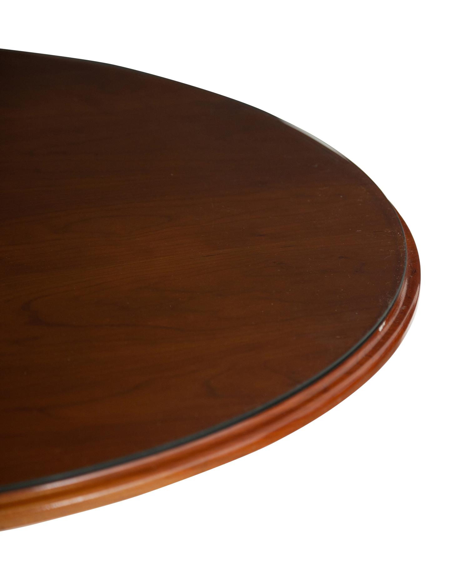 A Victorian Bistro Table with Iron Base and Cherry Top