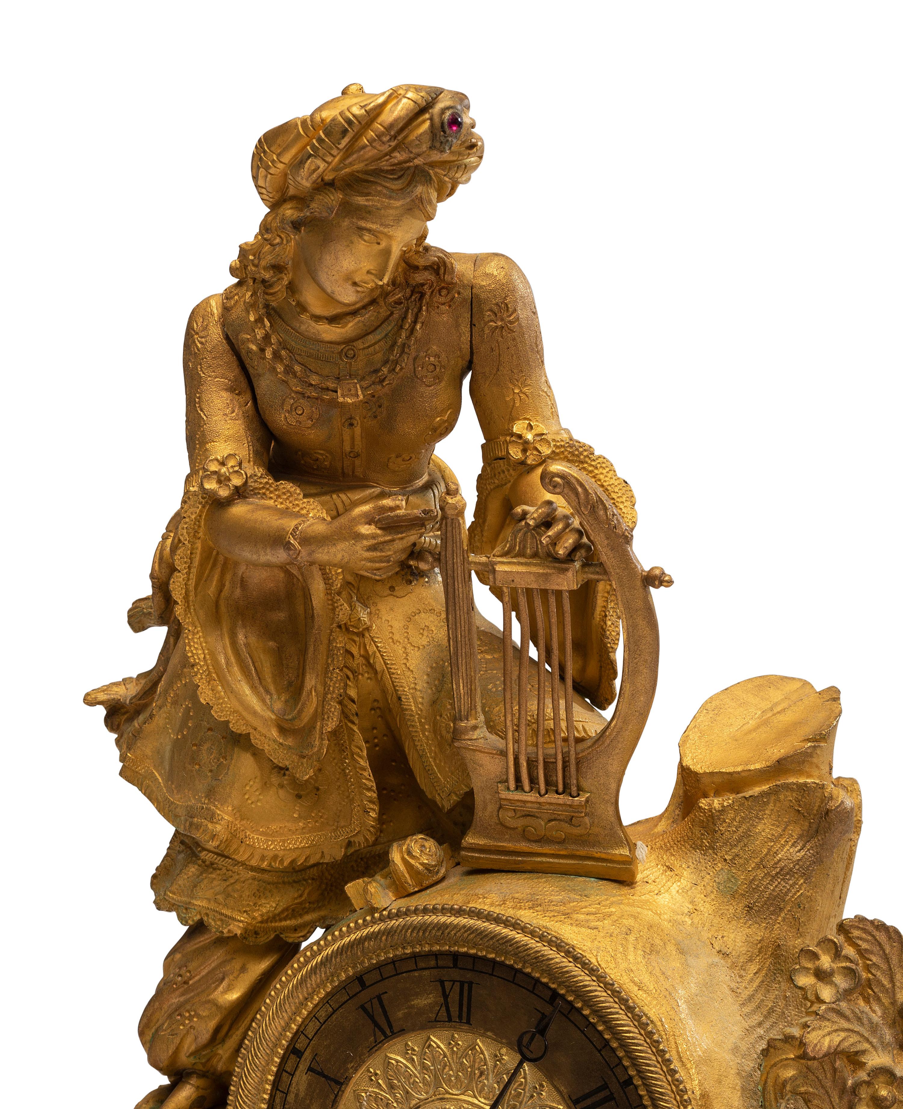 A Continental Gilt Metal Figural Mantel Clock