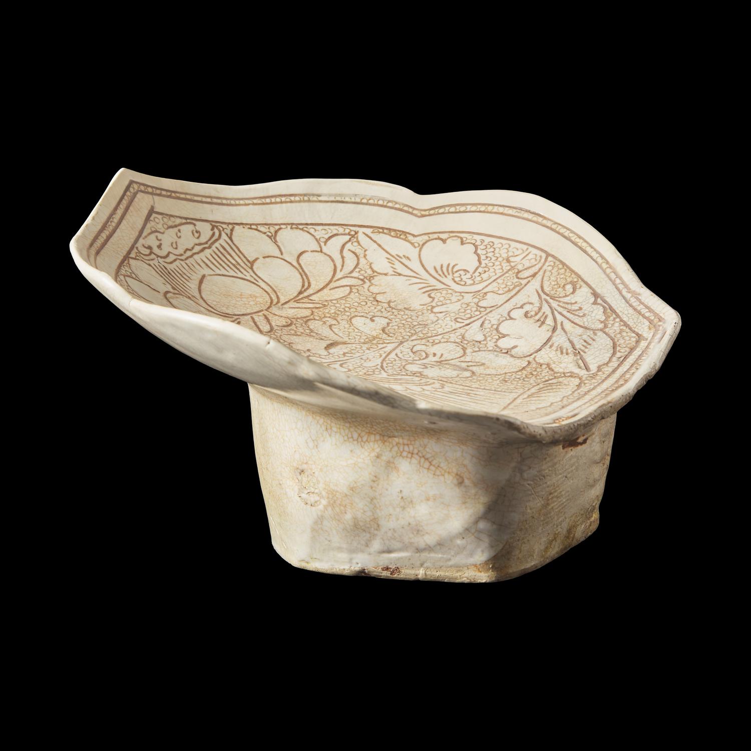 A Chinese Cizhou Stoneware 'Lotus' Pillow, Northern Song/Jin Dynasty 北宋/金 磁州窰珍珠地劃花蓮紋瓷枕