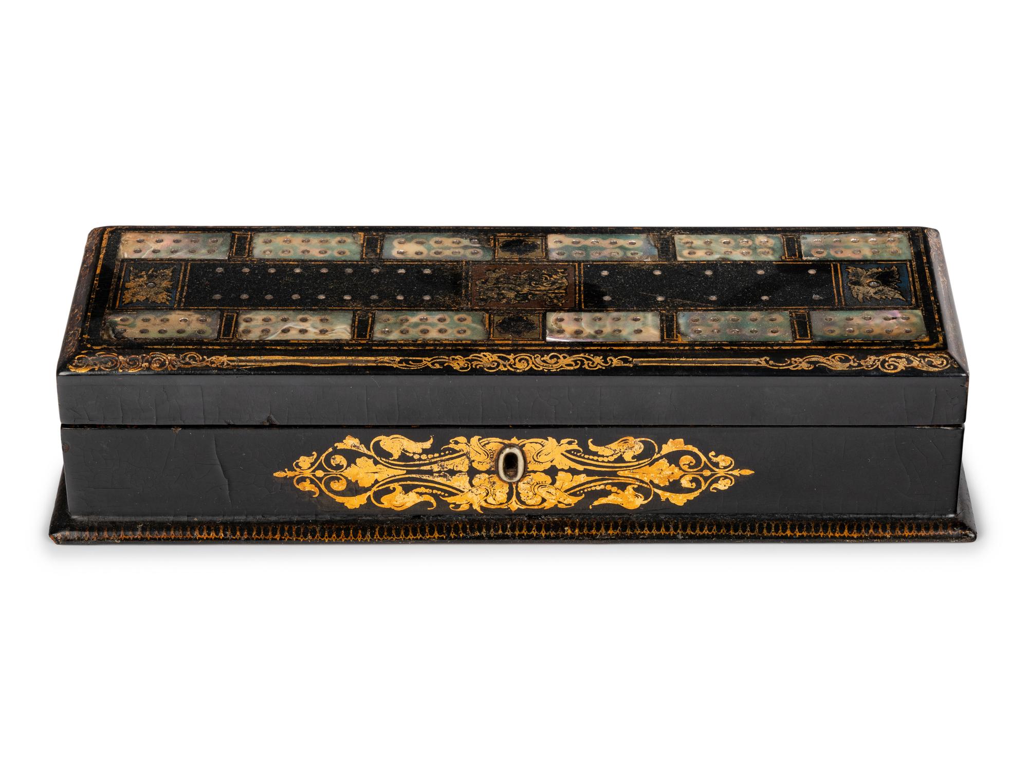 A Victorian Mother of Pearl-Inset and Parcel-Gilt Papier-Mache Cribbage Box
