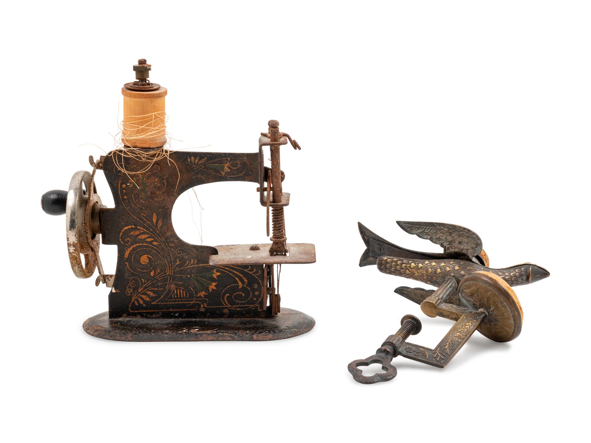 A Sewing Machine-Form Spool Winder and a Brass Sewing Bird