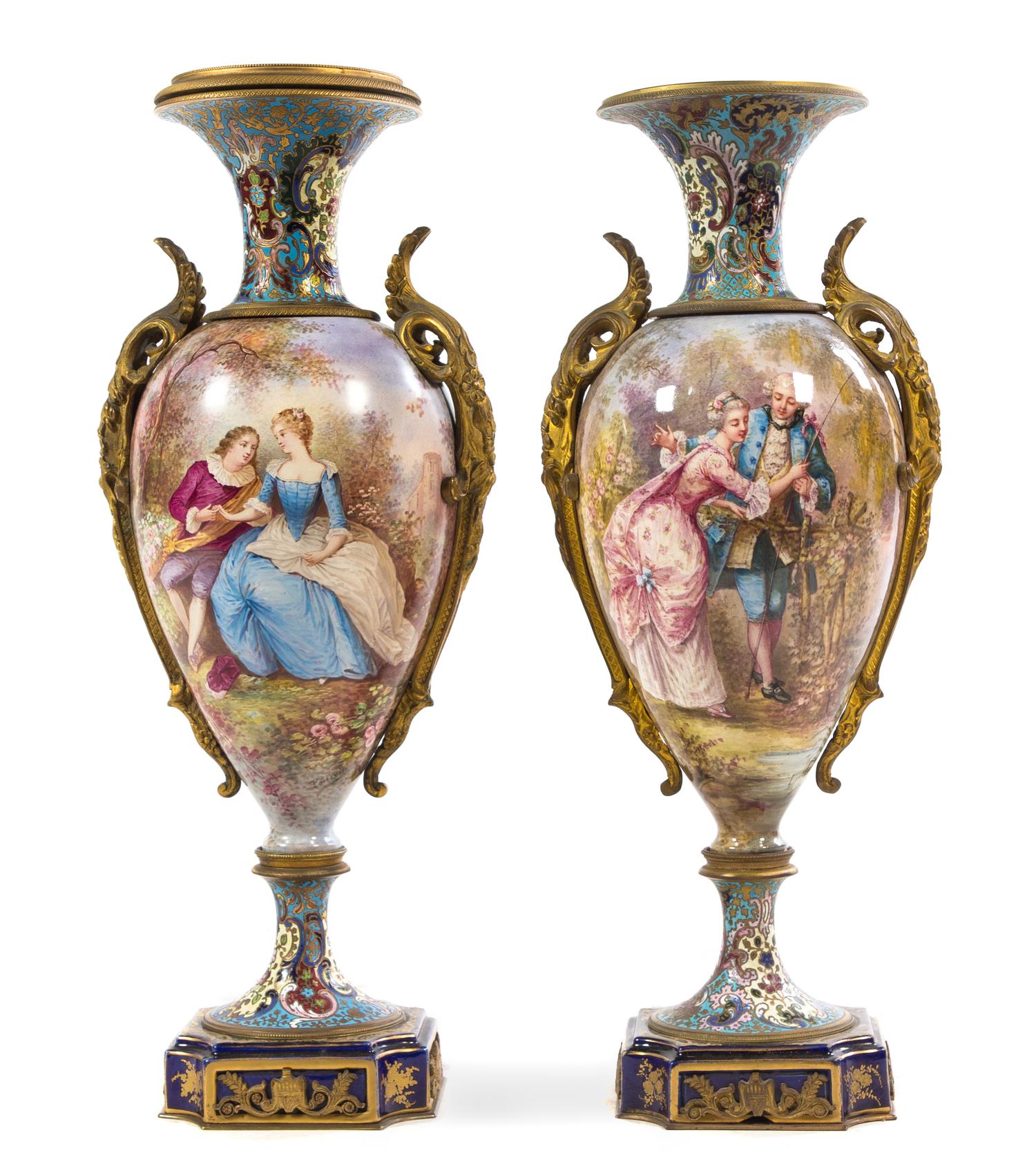 A Pair of Gilt Bronze Mounted Sevres Porcelain and Champleve Urns Height 20 inches. — 19TH CENTURY