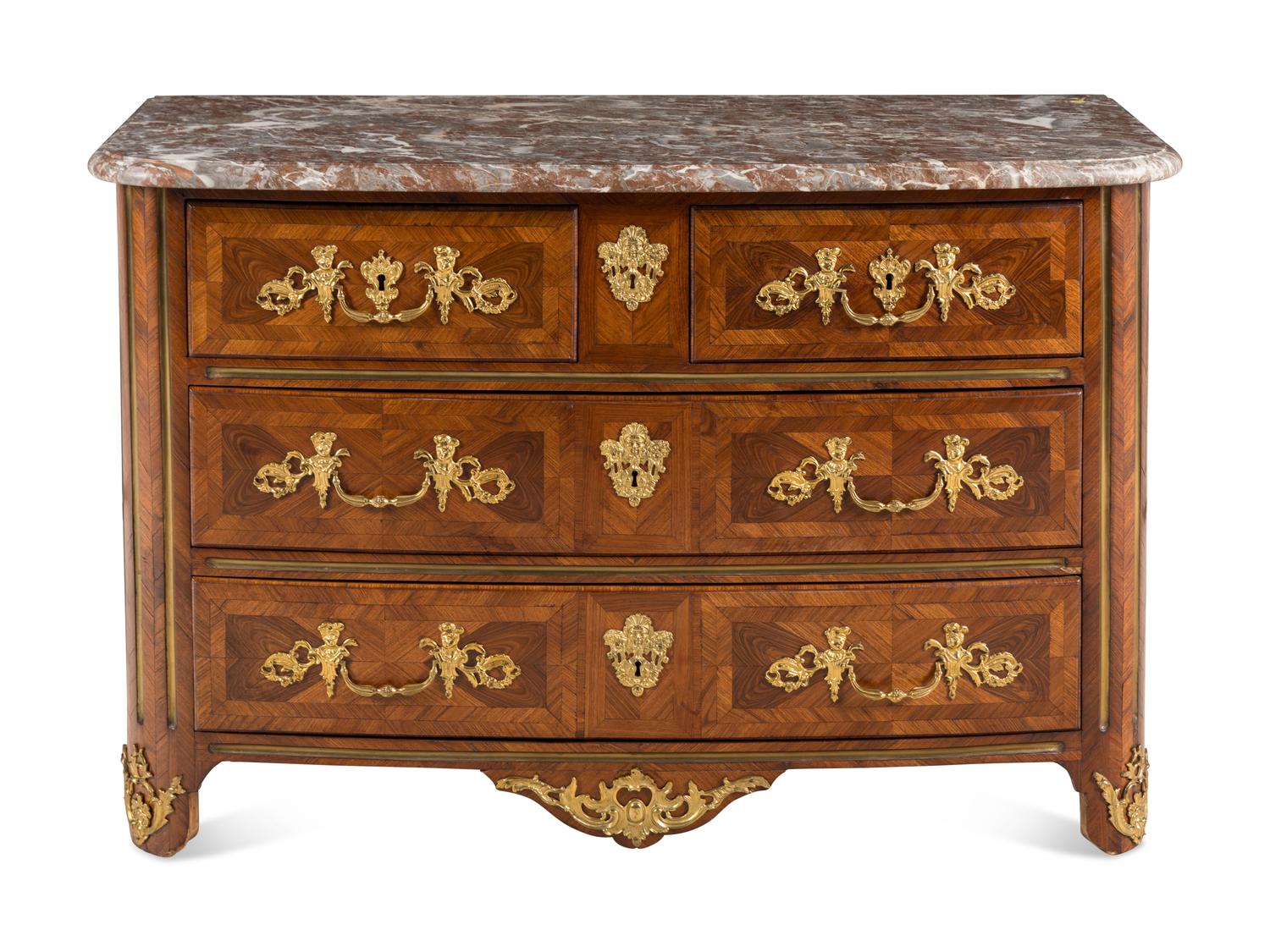 A Régence Gilt Bronze Mounted Walnut Parquetry Commode