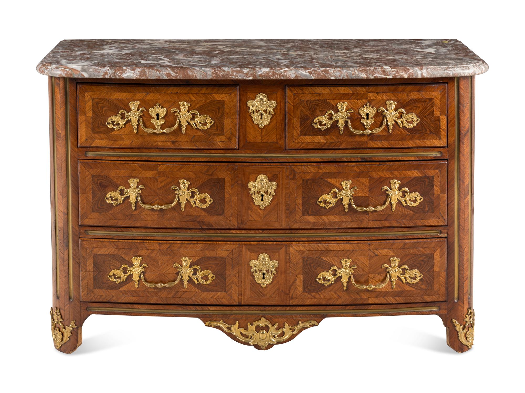 A Régence Gilt Bronze Mounted Walnut Parquetry Commode
