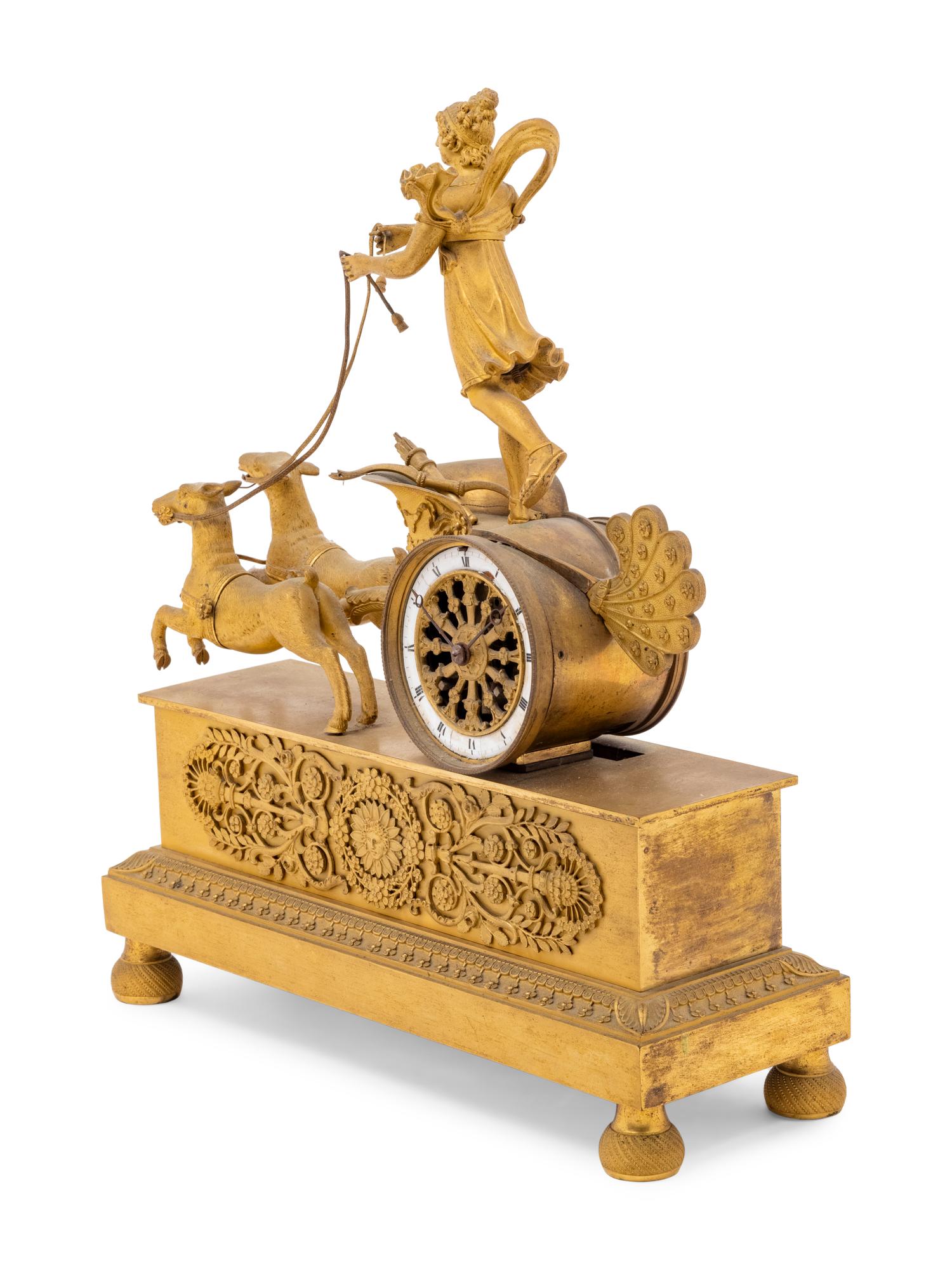 An Empire Style Gilt Bronze Figural Clock