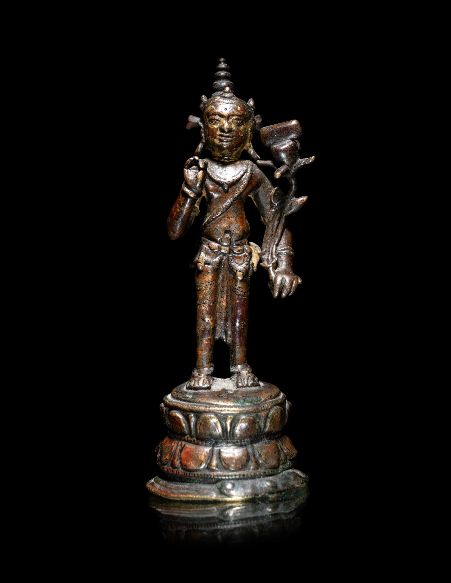 A Nepalese Parcel-Gilt Bronze Figure of Standing Avalokiteshvara