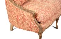 A French Provincial Carved Fruitwood Settee — 20TH CENTURY