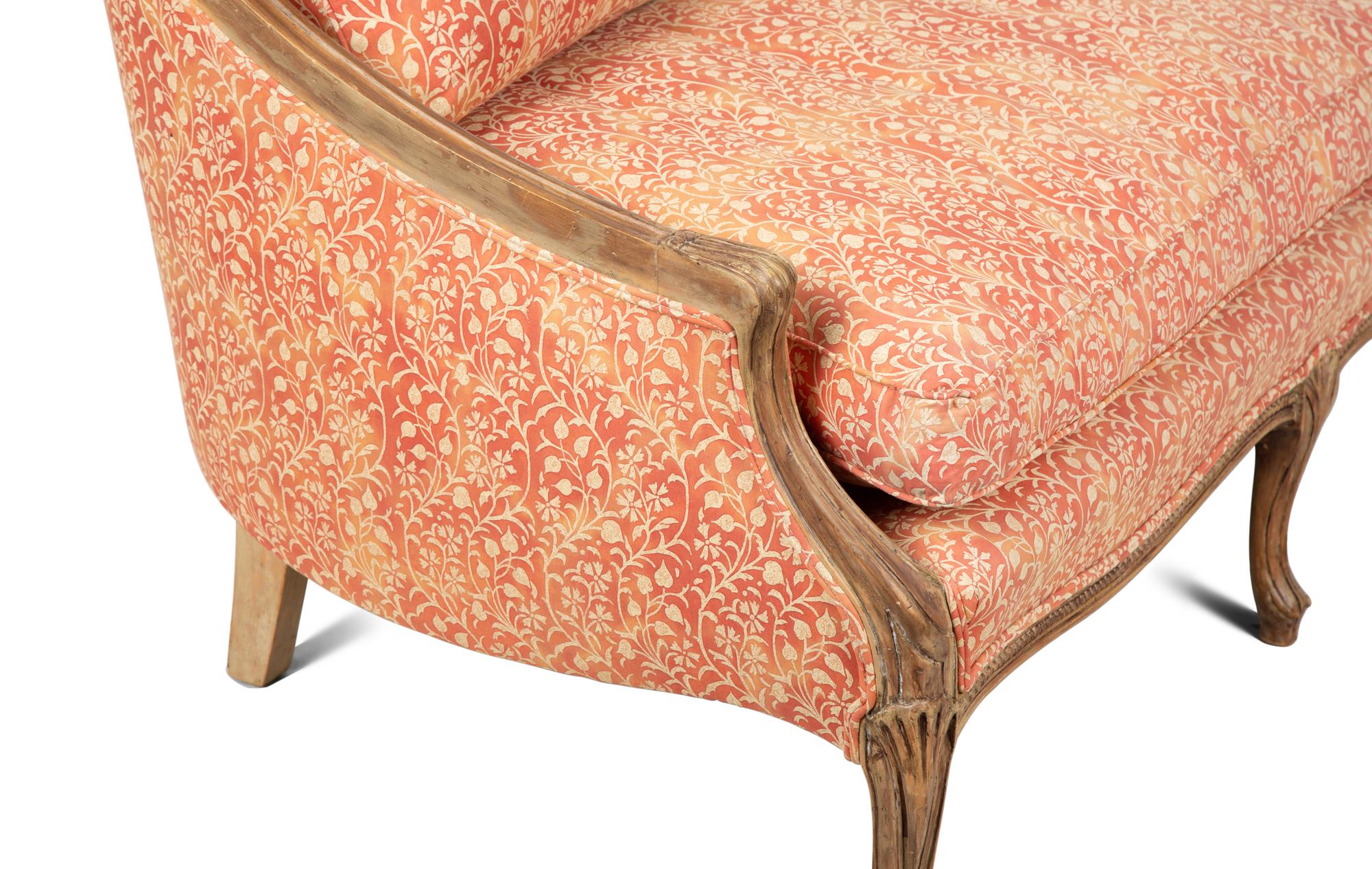 A French Provincial Carved Fruitwood Settee — 20TH CENTURY