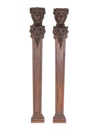 A Pair of Continental Carved Oak Figural Pilasters