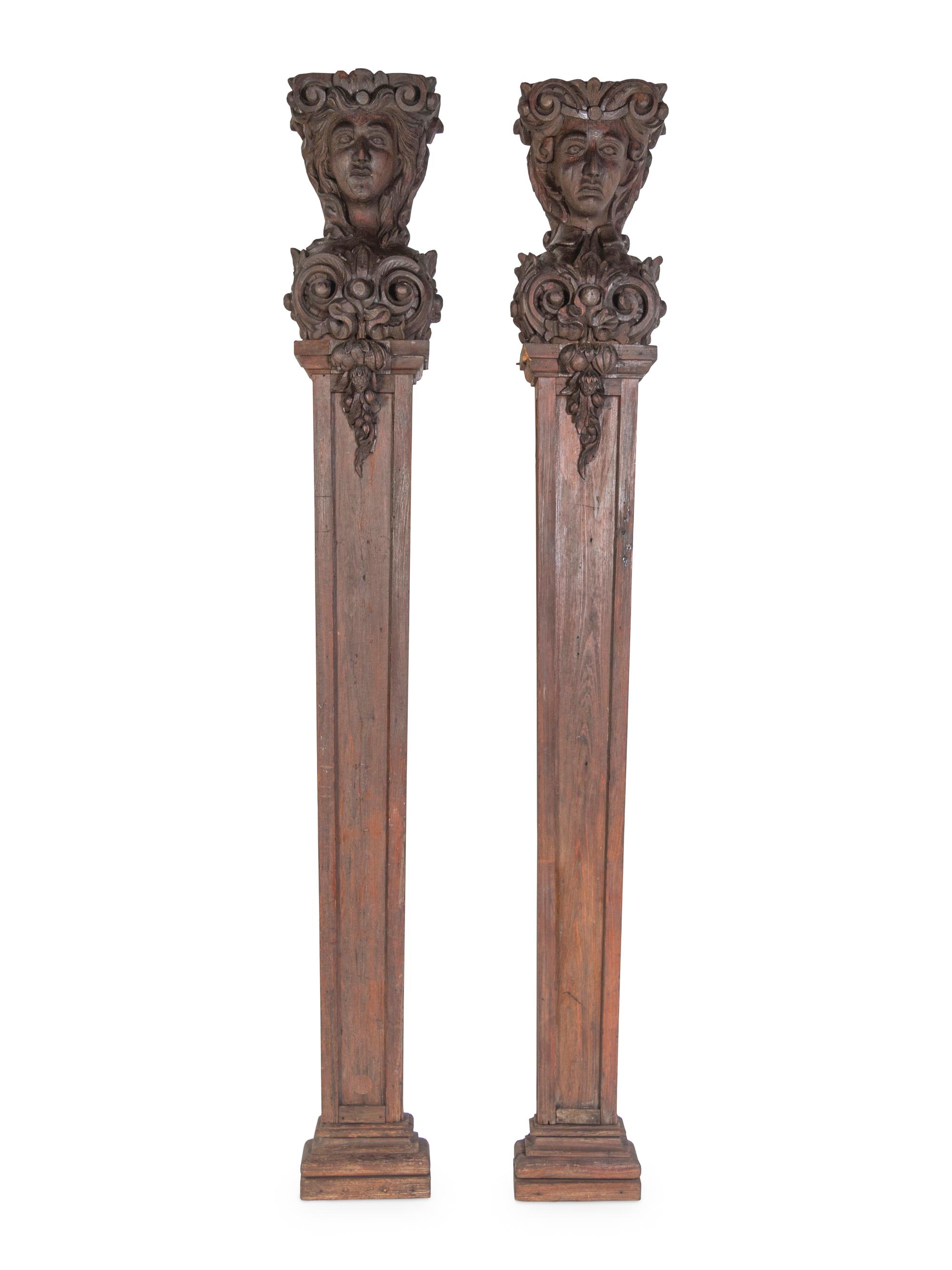 A Pair of Continental Carved Oak Figural Pilasters