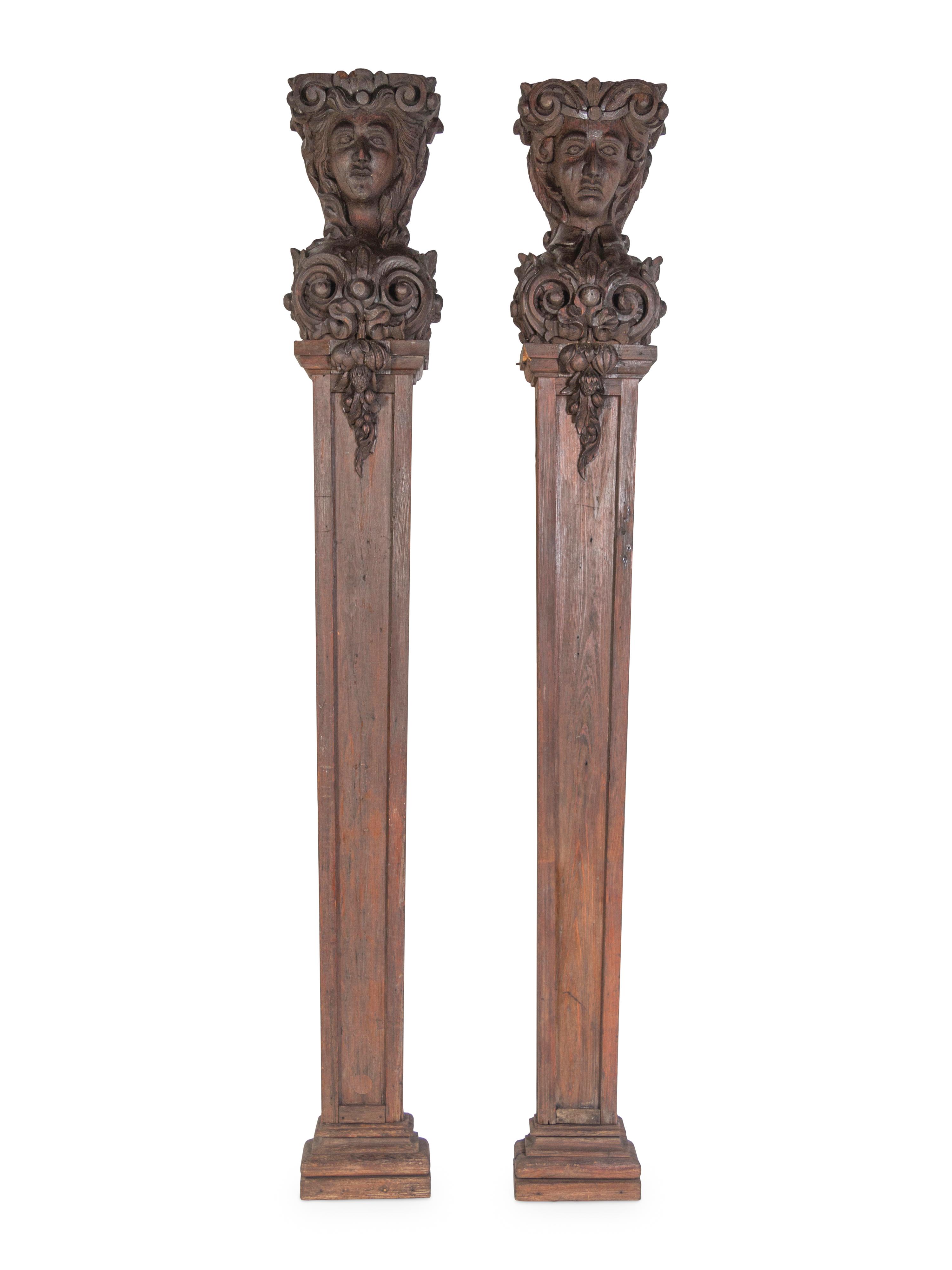 A Pair of Continental Carved Oak Figural Pilasters