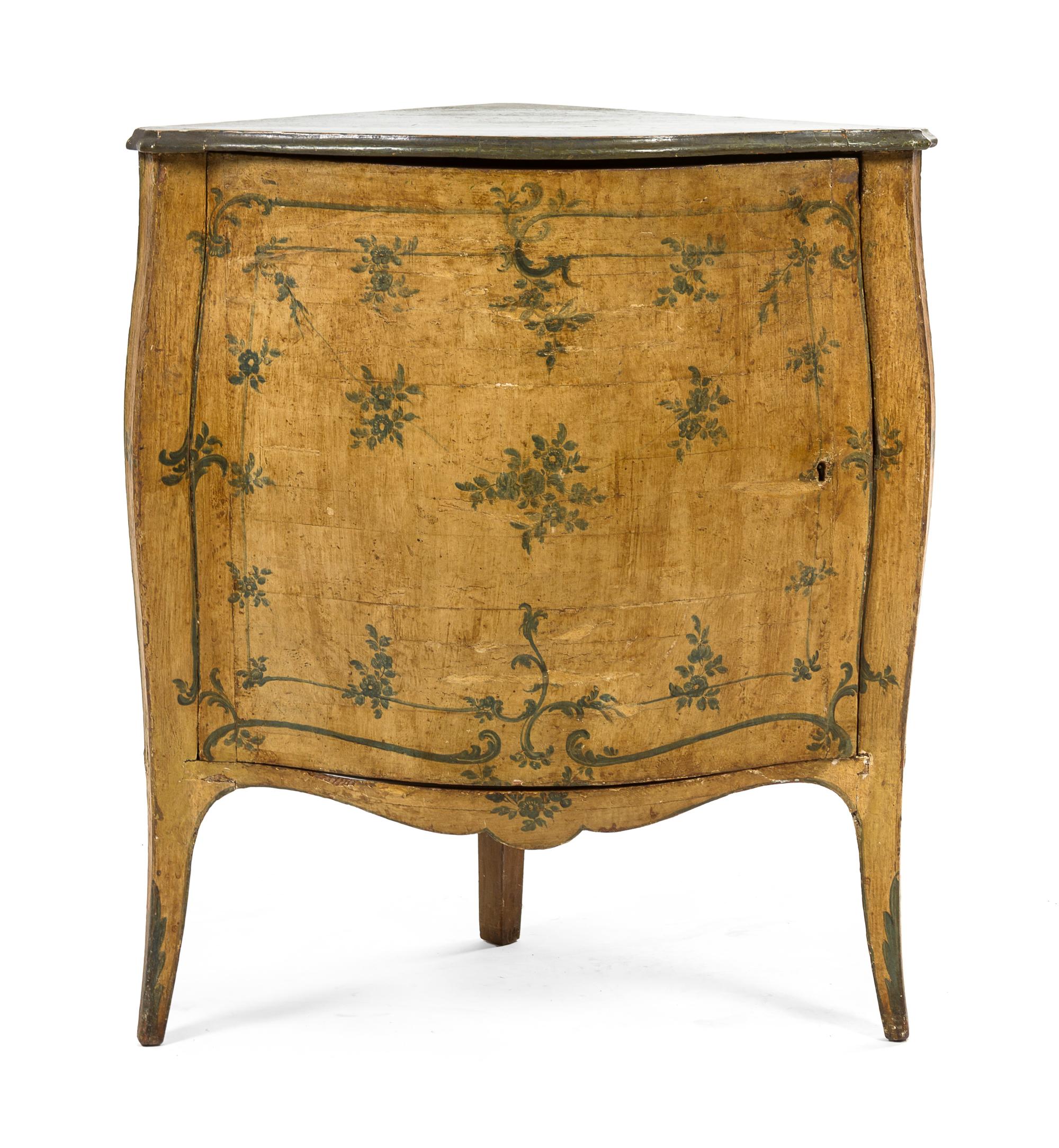 An Italian Painted Corner Cabinet, Height 34 1/2 x width 29 1/2 x depth 20 inches.