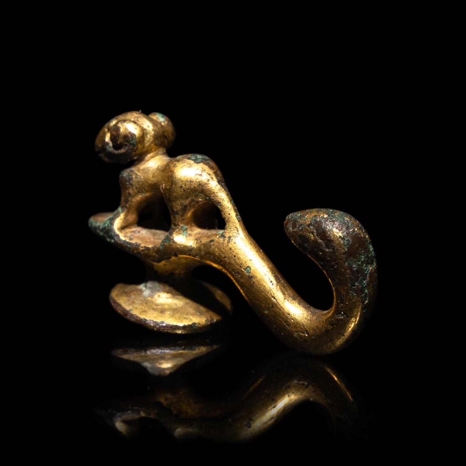 A Chinese Gilt-Bronze 'Ram' Belt Hook, Han Dynasty 漢 銅鎏金羊首帶鈎