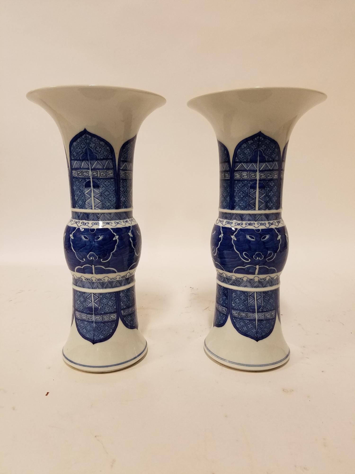 A Pair of Blue and White Gu Vases. Height of each 13 1/4 inches.