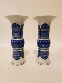 A Pair of Blue and White Gu Vases. Height of each 13 1/4 inches.