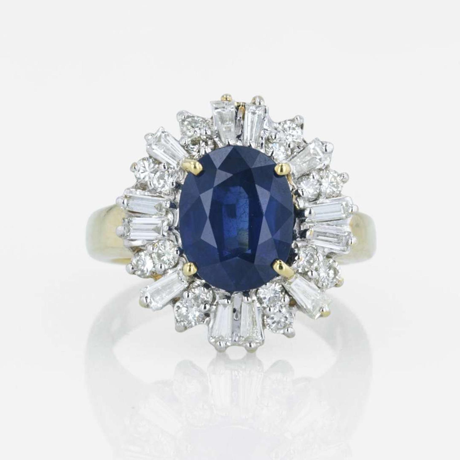 An 18K yellow gold, sapphire, and diamond ring