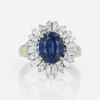 An 18K yellow gold, sapphire, and diamond ring
