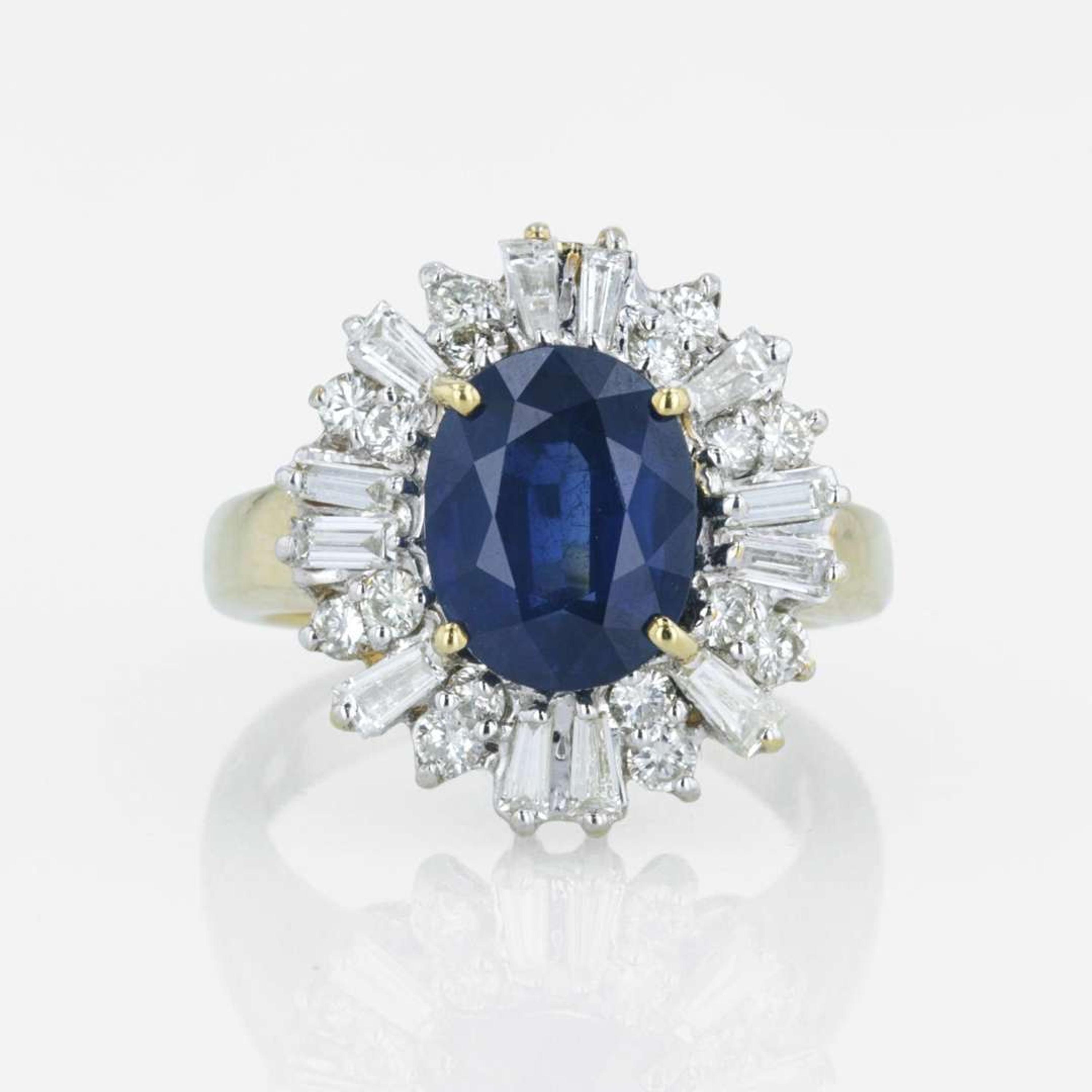 An 18K yellow gold, sapphire, and diamond ring