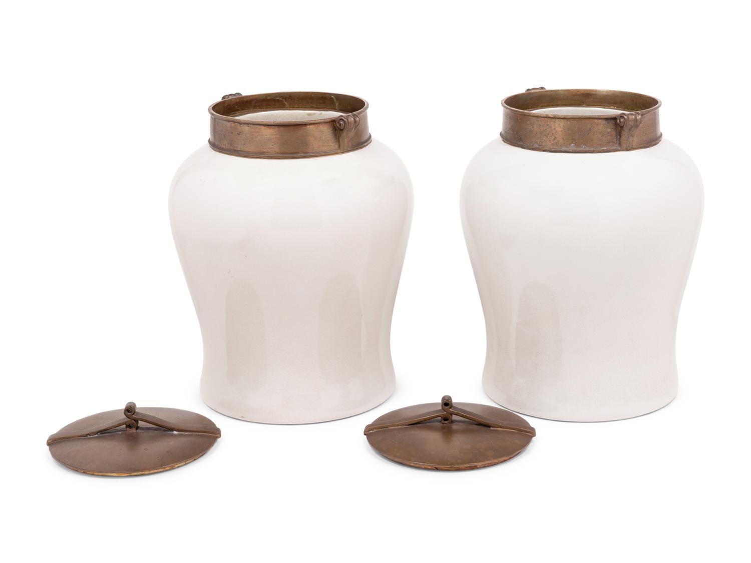 A Pair of Brass Mounted White Glazed Porcelain Jars